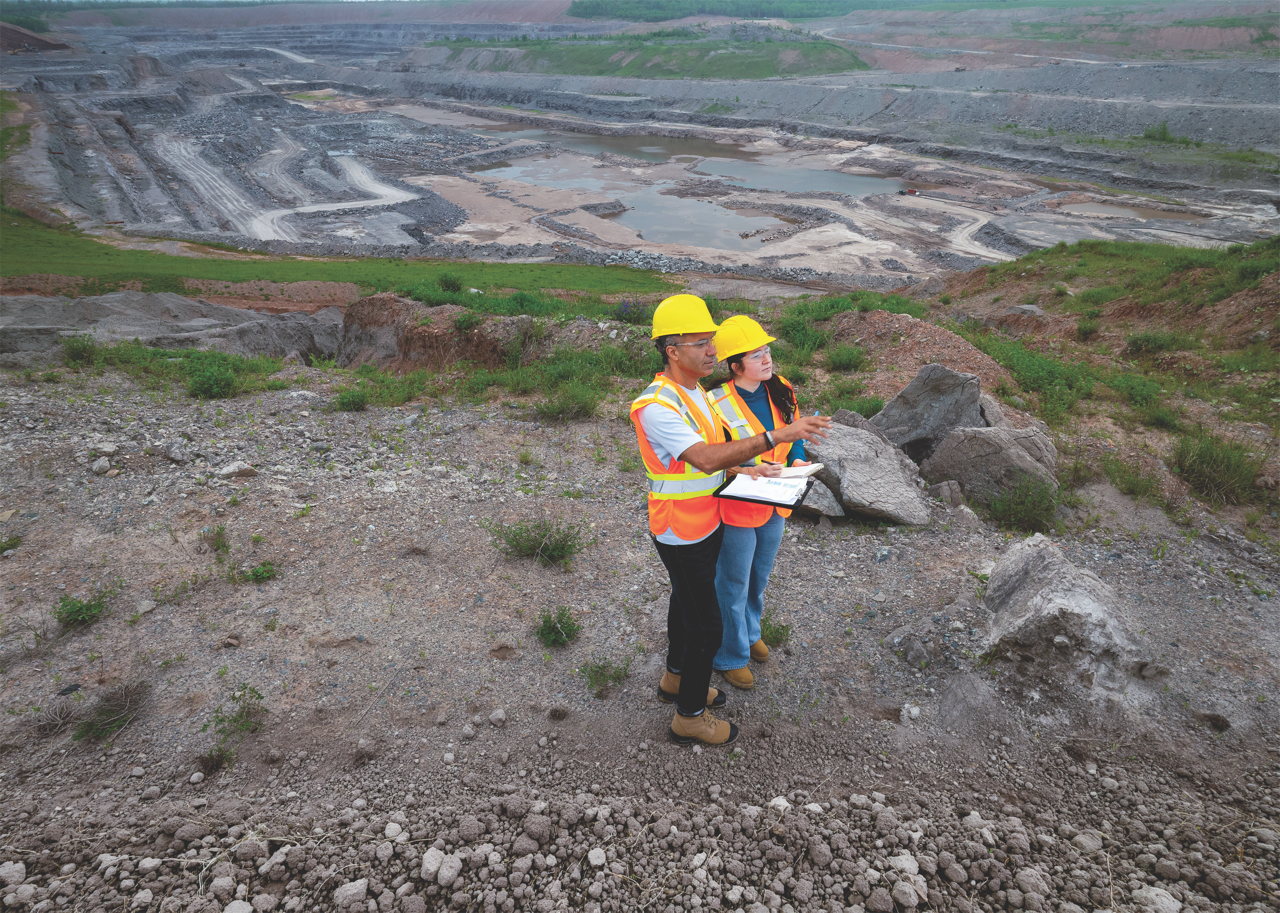 Student and professor in mine