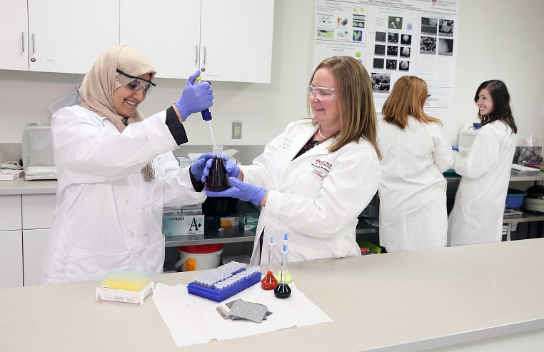 
Dr. Christa Brosseau in the lab working with her students
