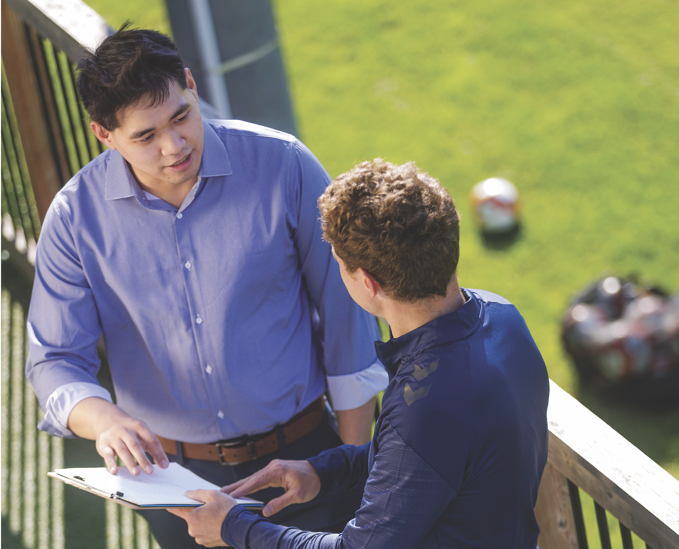 Business student on a work placement at soccer field