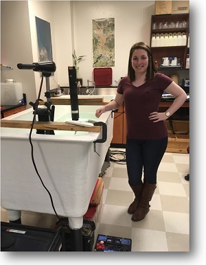 Julia Purcell standing within a laboratory