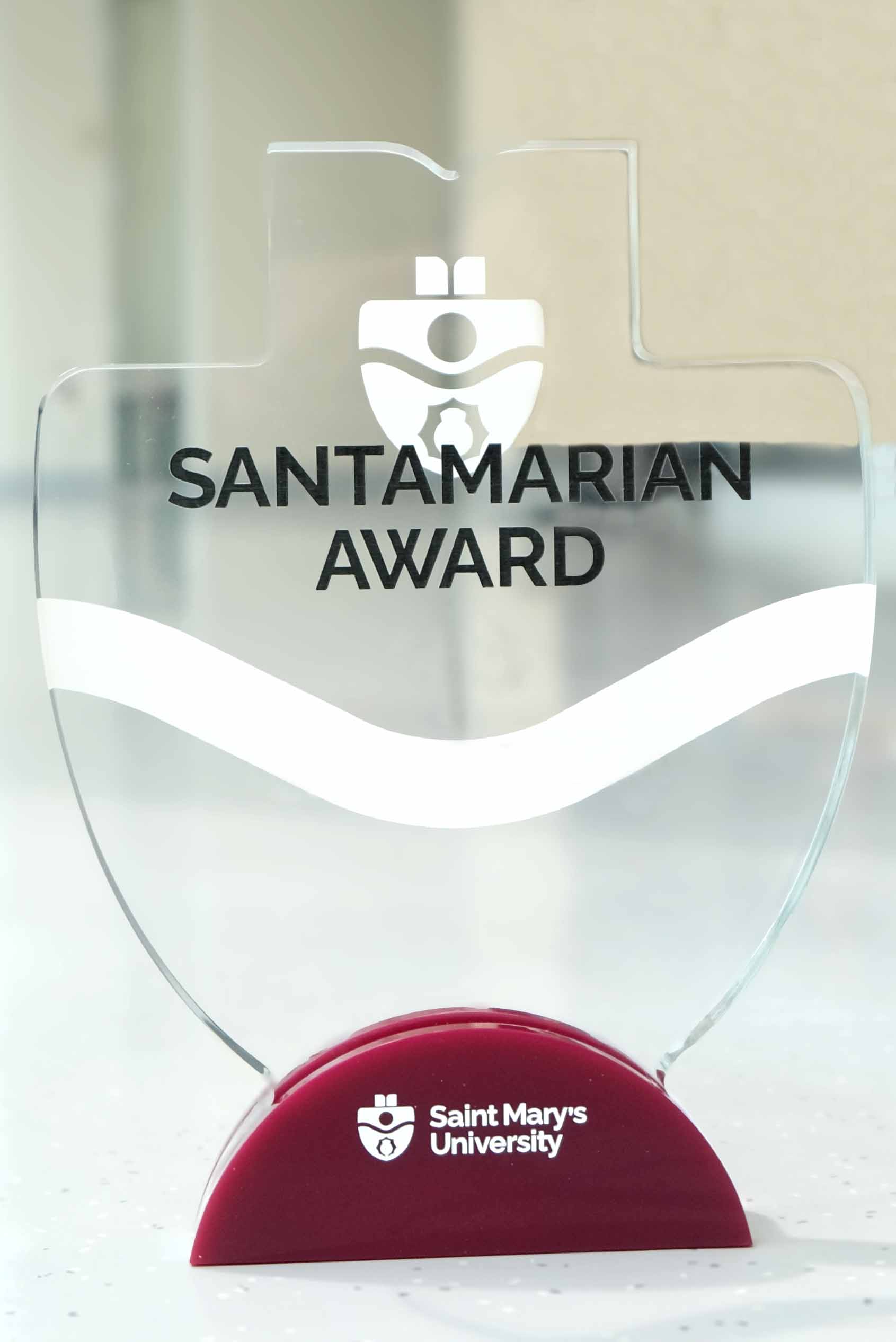 A picture of a Santamarian Award with the SMU logo.