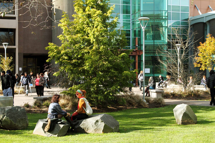 Students chat outside the Atrium Building on the Saint Mary's campus.