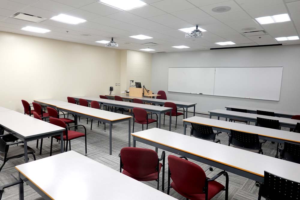 Classroom HC211 with tables ad chairs set up in parallel rows