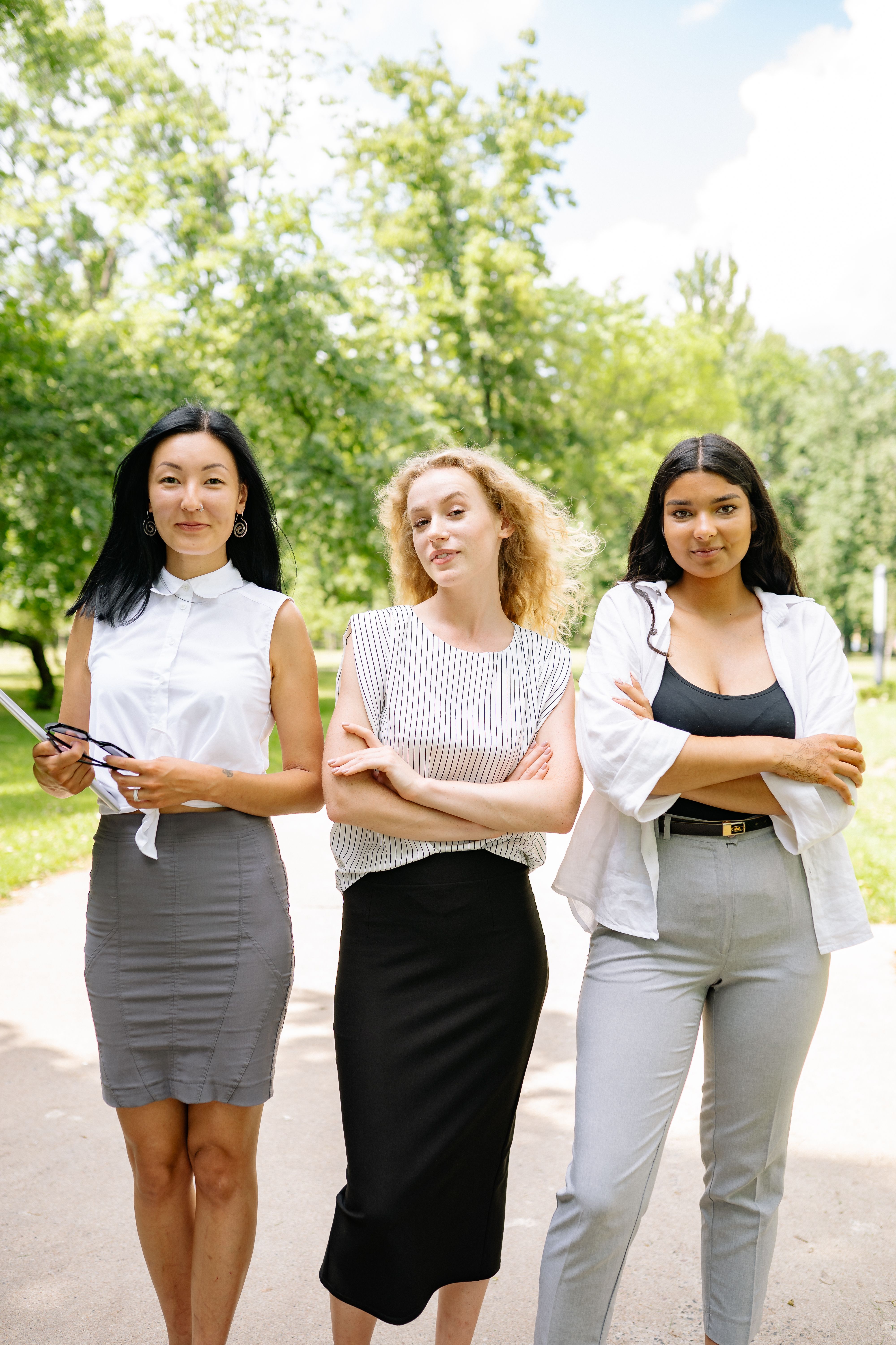 Photo from Pexels (Yankrukov) of three confident professional young women.